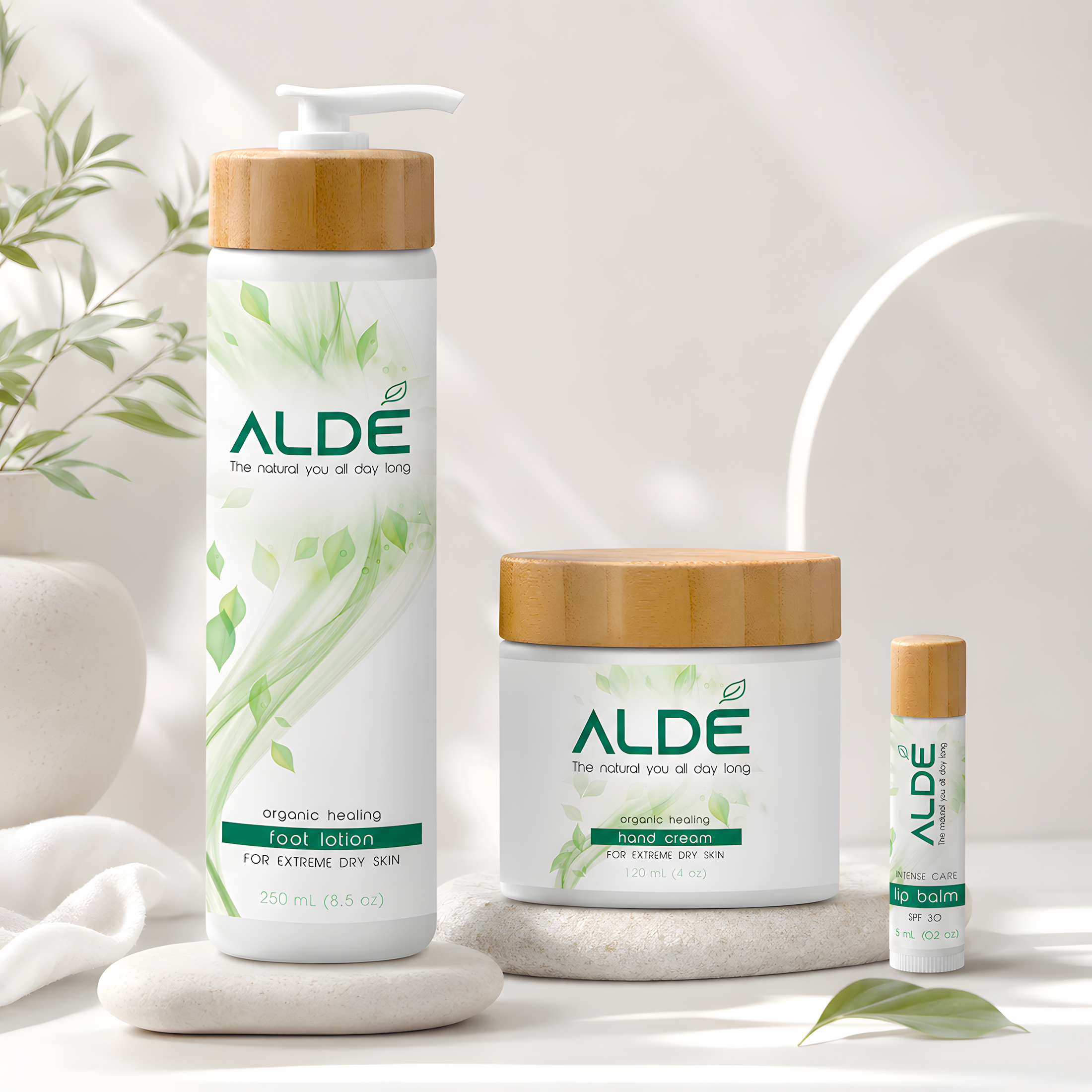 ALDE Naturals skincare packaging with lotion, cream, and lip balm containers